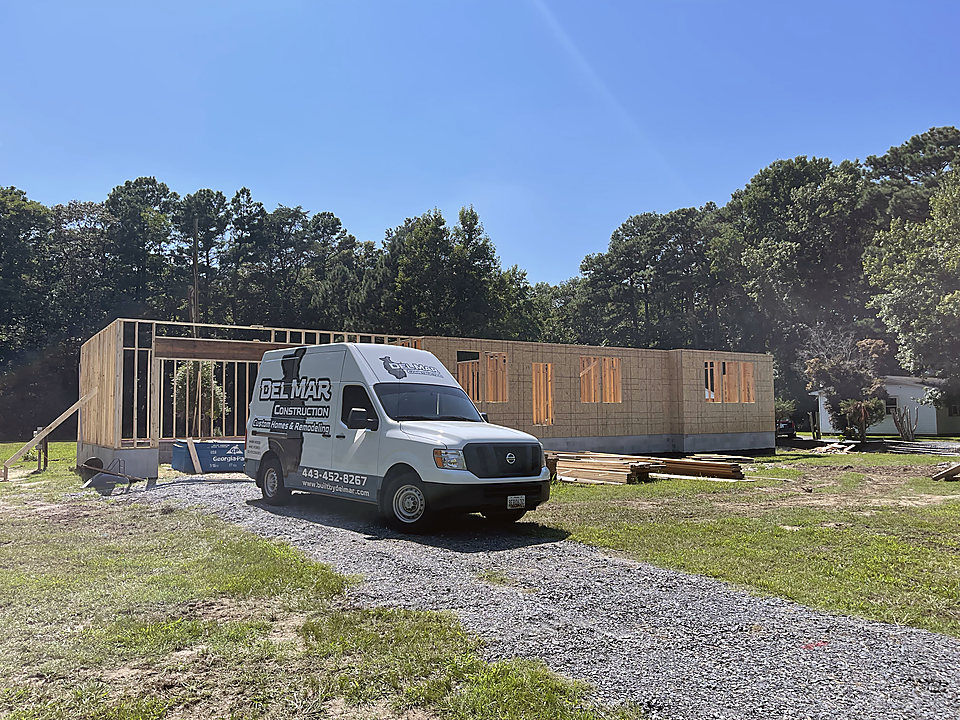 A framed addition with the Del Mar van on site