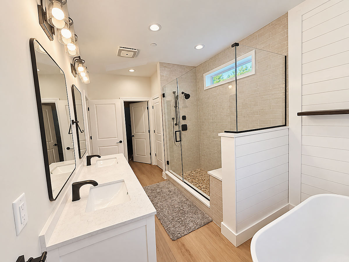 A Del Mar bathroom: a double vanity and tub with a shiplap wall