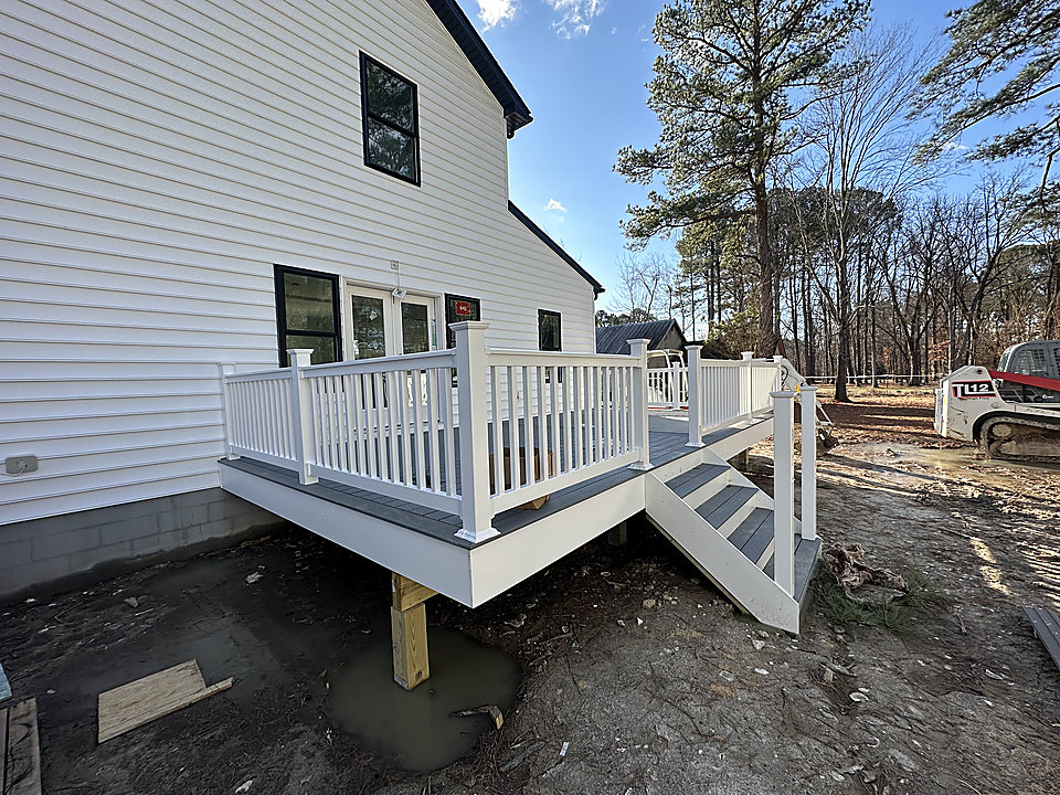 New deck with white railings and stairs