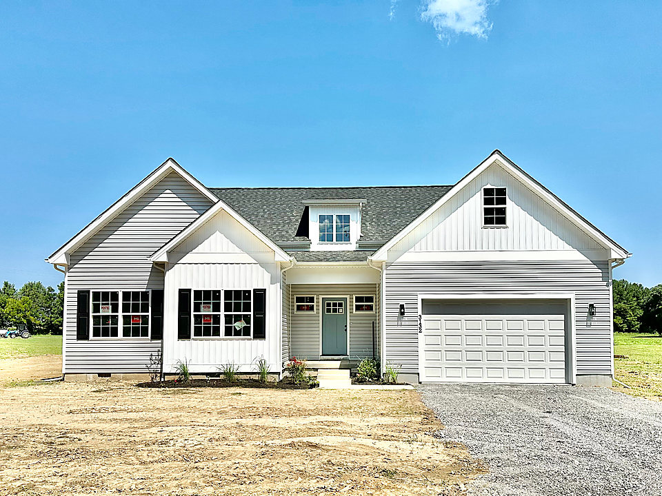 A finished custom home with board-and-batten gables
