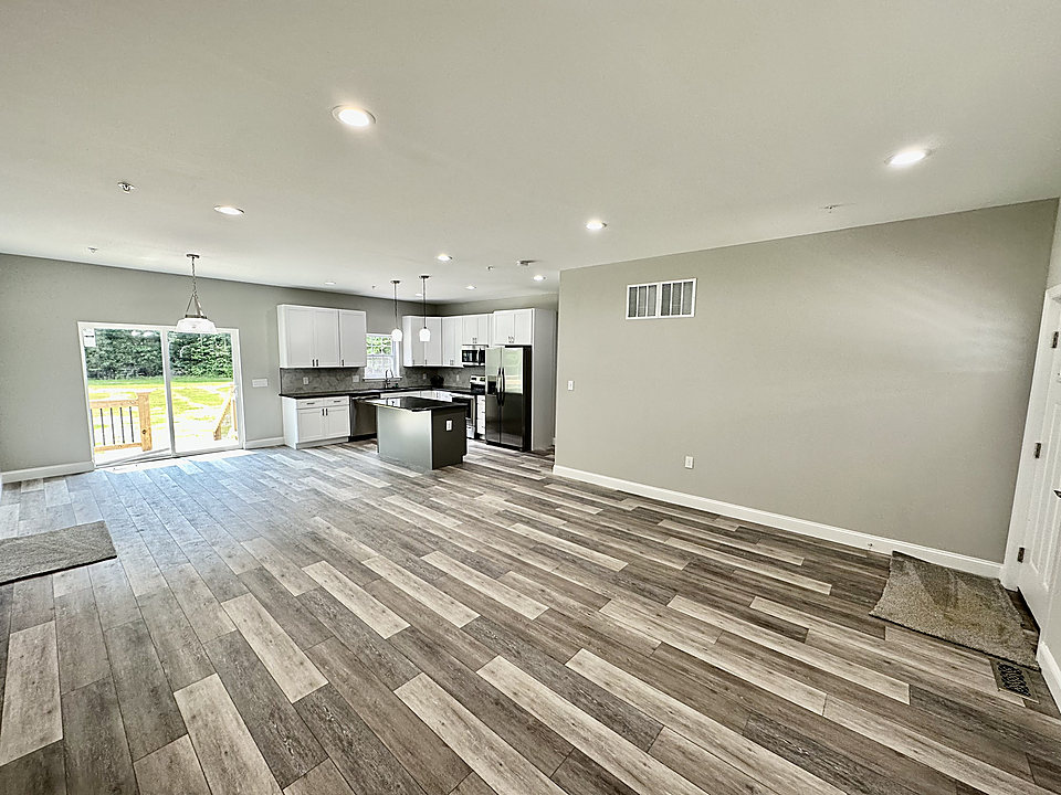 Luxury vinyl plank flooring through an open living area