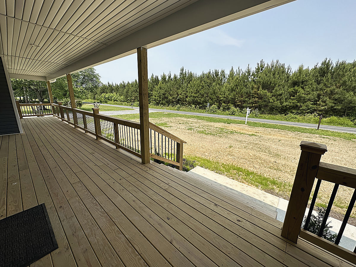 A custom home in Trappe: a rear deck with railings