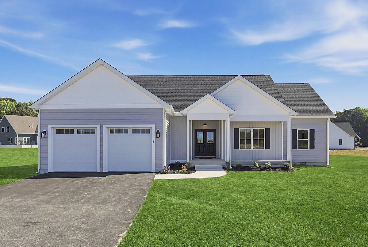 A coastal rancher in Berlin: the two-car garage side of a gray rancher