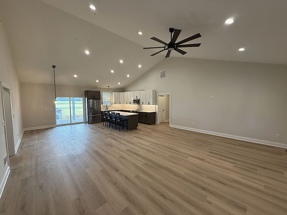 A custom home in Whaleyville: a living room with luxury vinyl plank floors