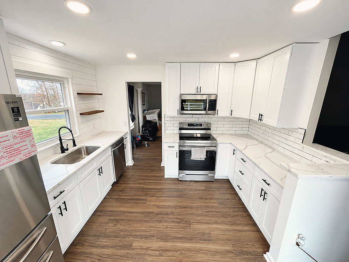 A Del Mar kitchen: a white kitchen open to the living room