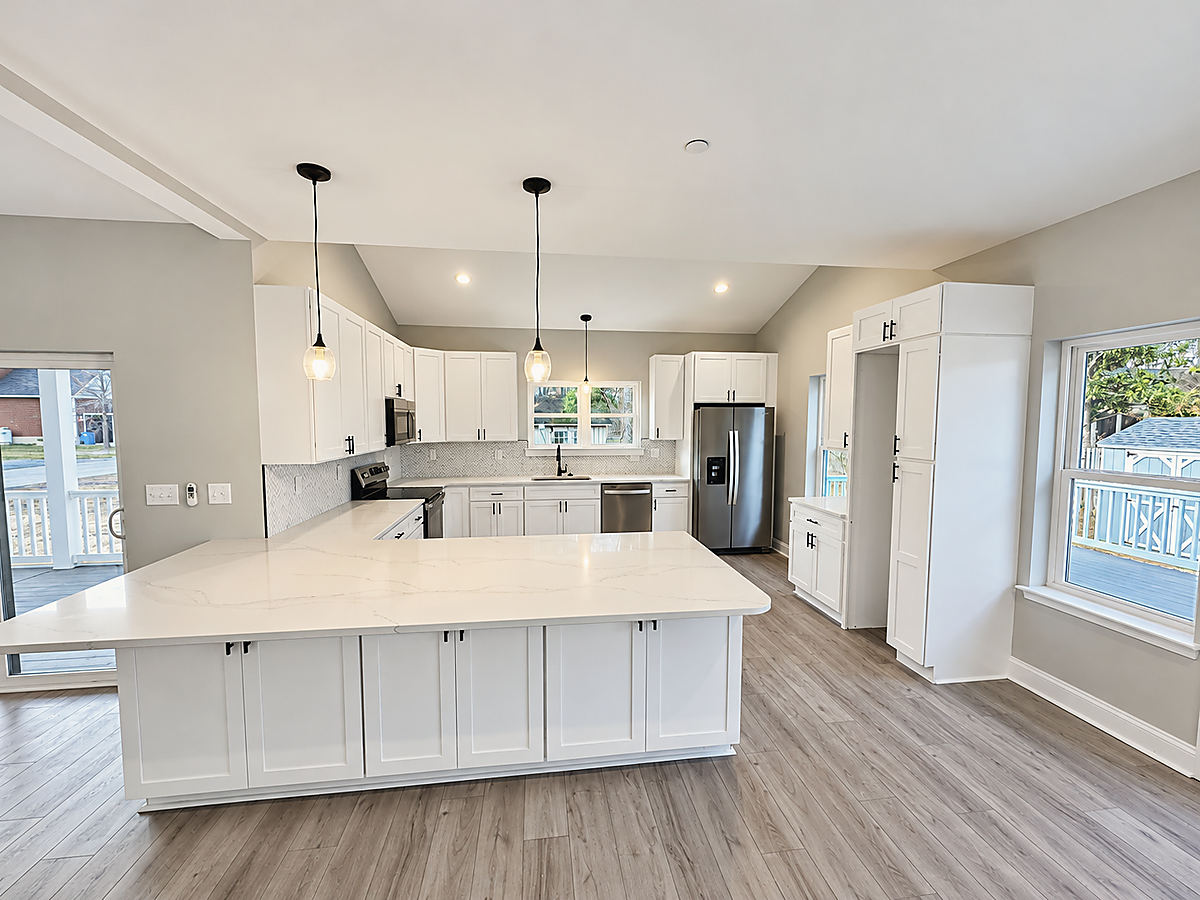 A Del Mar kitchen: a white kitchen with a large island
