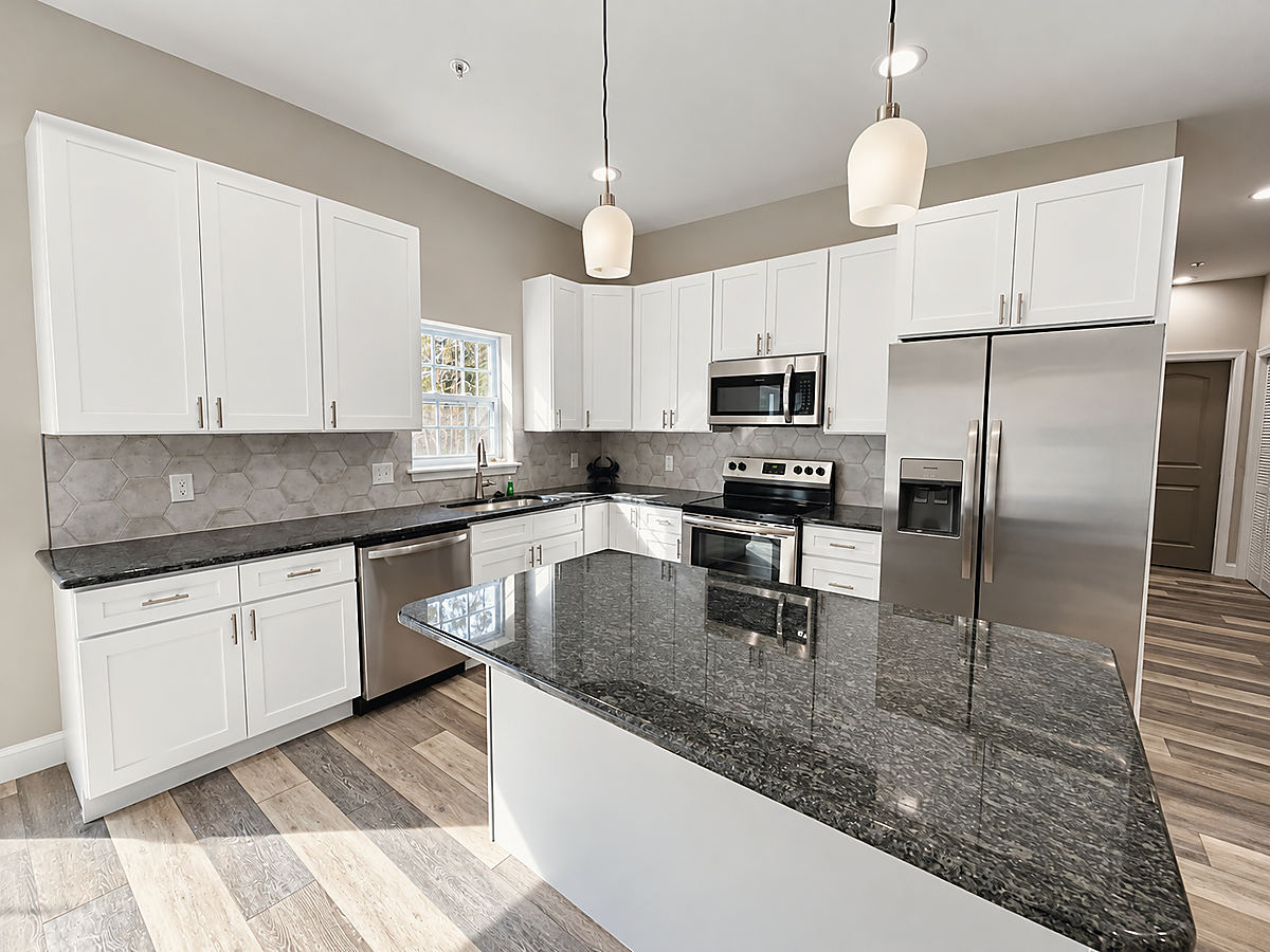 A Del Mar kitchen: a kitchen with a dark granite island