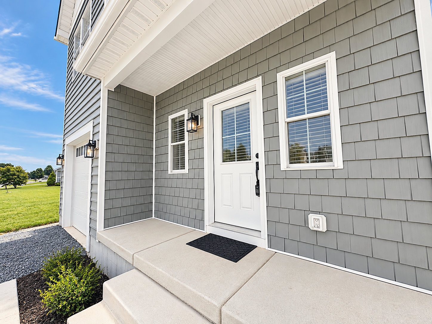 The covered front porch and front door at 1402 Cedar Run