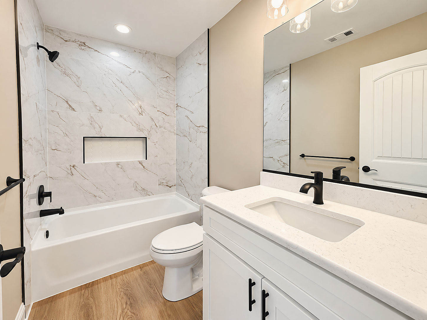 A bathroom at 1402 Cedar Run with a tiled tub surround