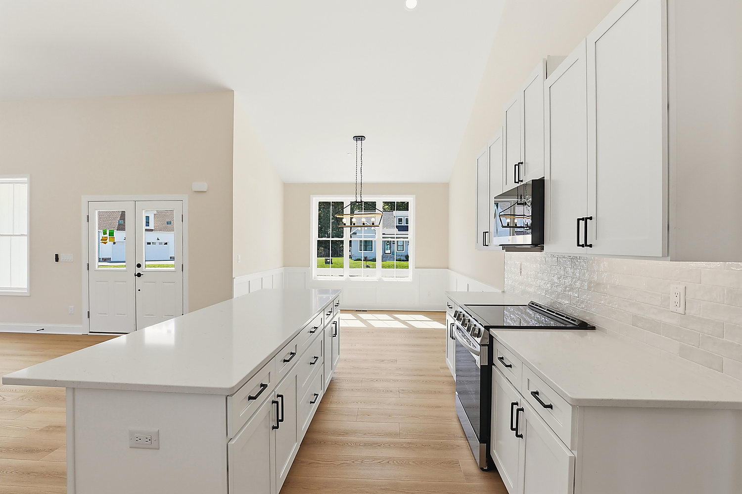 The kitchen at 6 Preakness Drive: shaker cabinets, quartz counters and a large center island