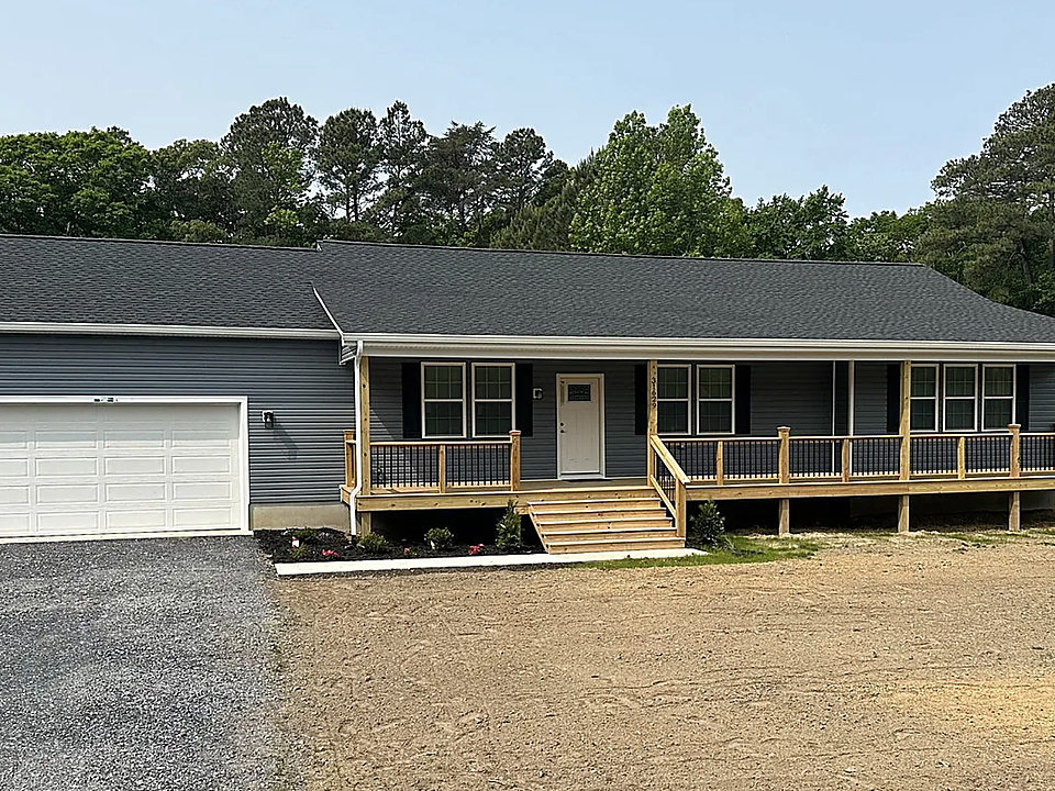 A ranch home with a long front porch