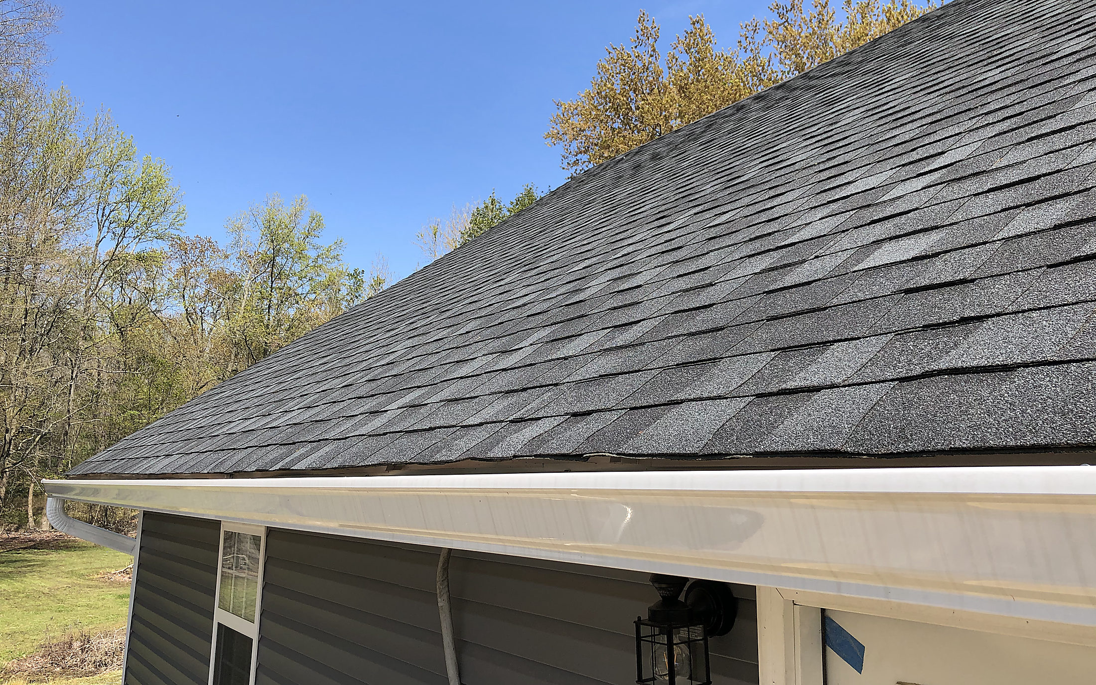 A restored roof and siding after storm damage