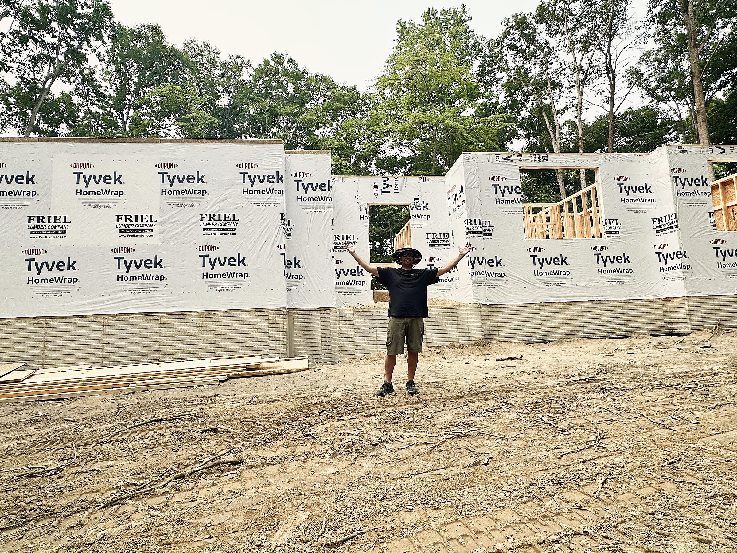 Dale Hunter in front of a Del Mar home framed and wrapped, ready for siding